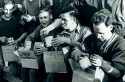 Priosners of War opening food parcels