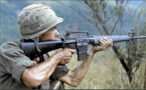 Soldier aiming a rifle during Operation “Cook”, 8 September 1967, Quang Ngai Province, Republic of Vietnam